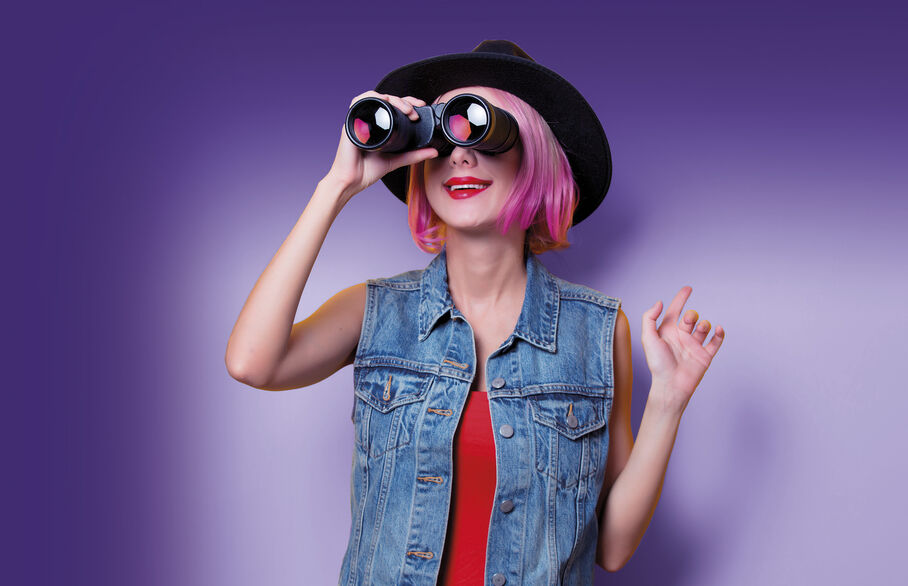 Girl looking through binoculars