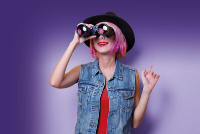 Girl looking through binoculars