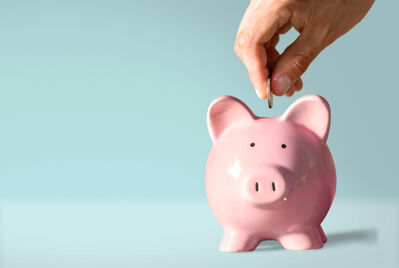 Putting money in Piggy Bank